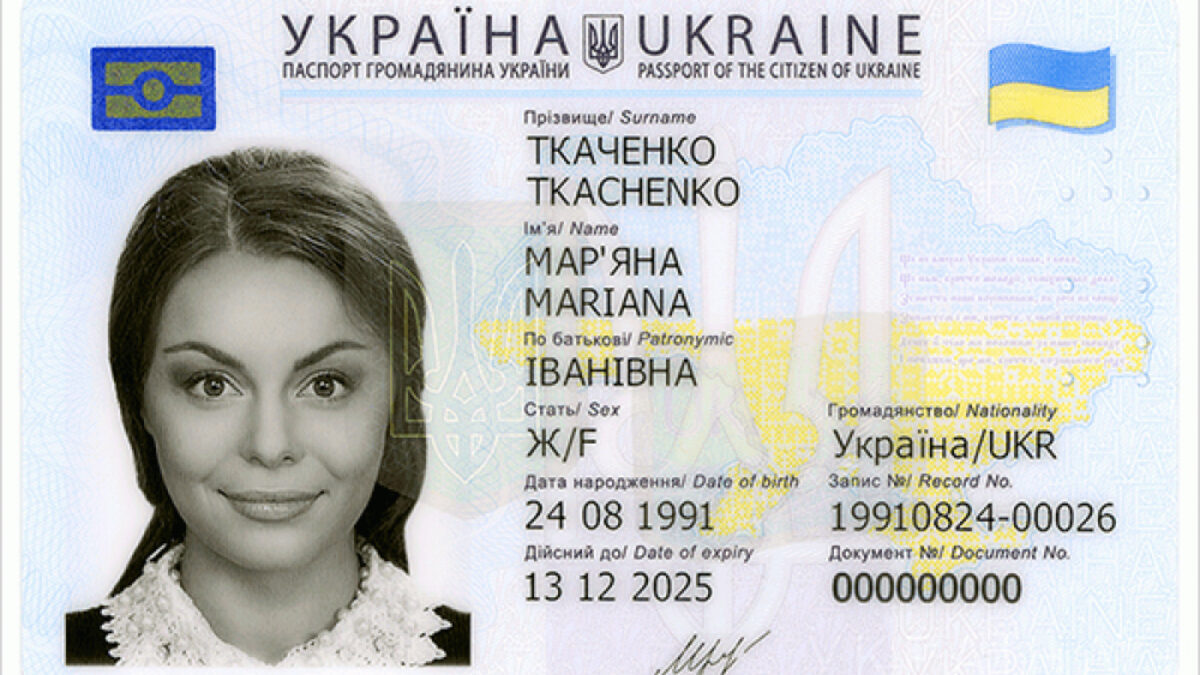 An open passport photo page, the kind of government ID that age-verification systems ask users to upload.