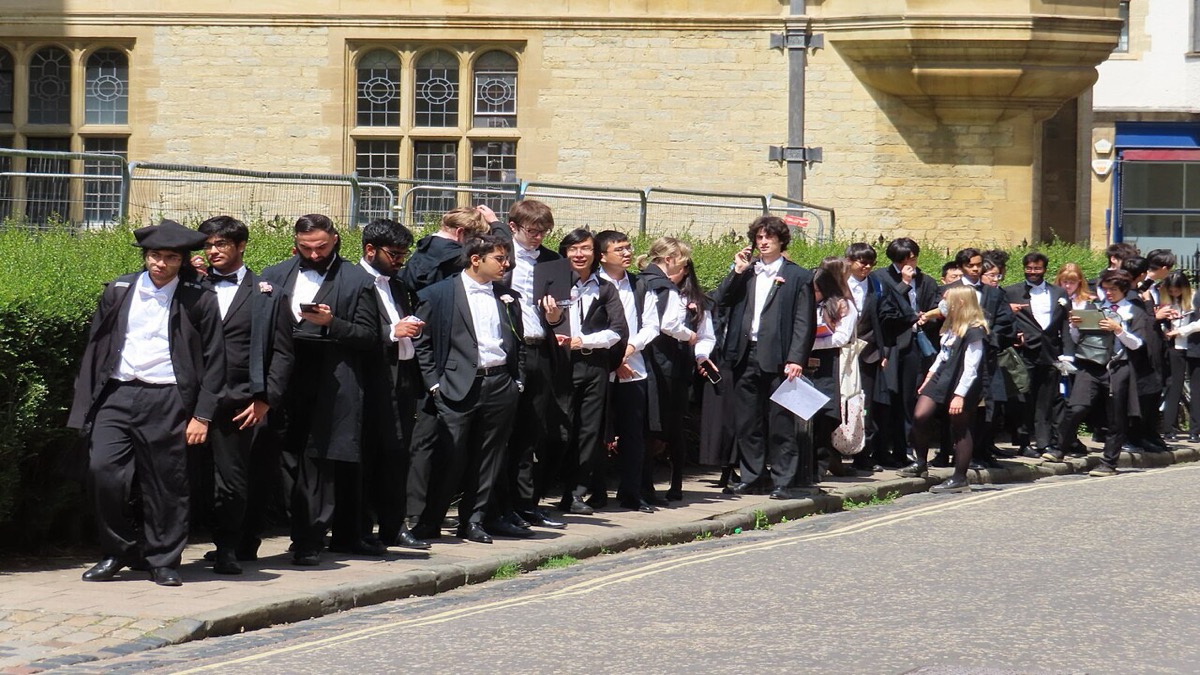 University students filing into an examination hall to sit a written exam