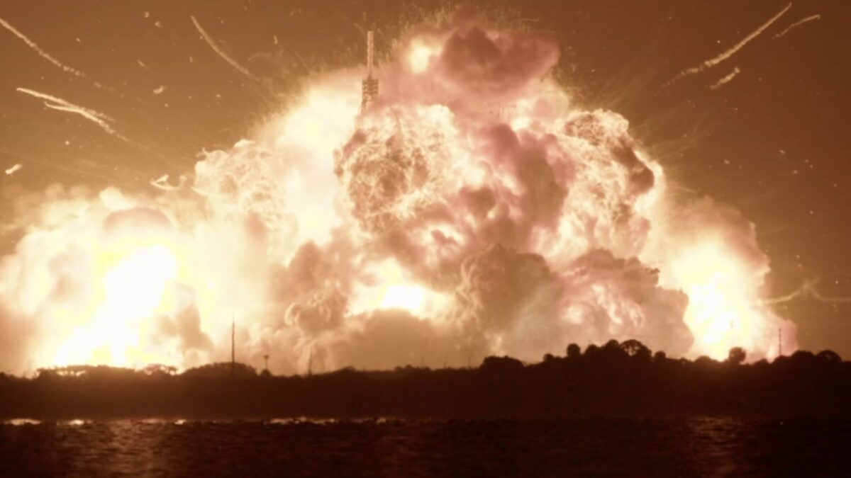 A massive fireball engulfs Blue Origin's New Glenn rocket on the launch pad at Cape Canaveral at night.