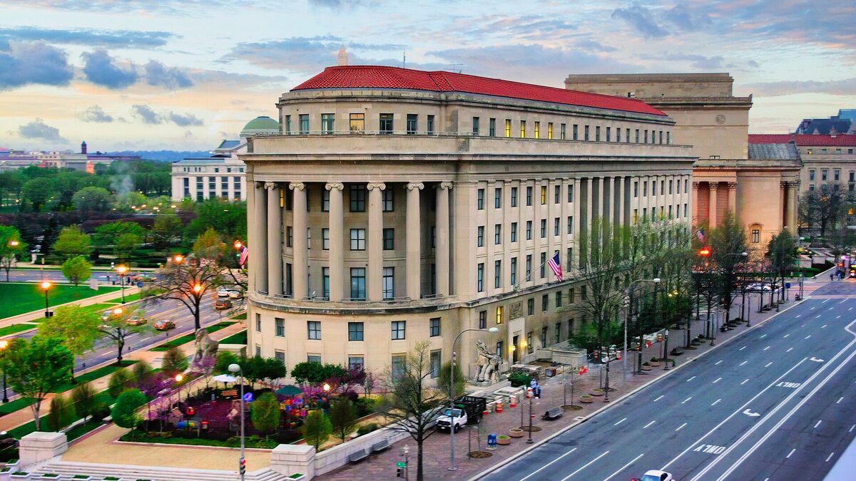 The Apex Building, the Federal Trade Commission headquarters, seen from above at dusk on Constitution Avenue in Washington, D.C.