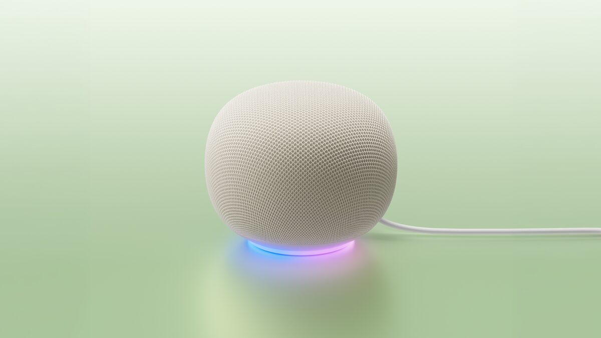 Google Home Speaker in Porcelain, a fabric-wrapped cylinder with a light ring at the base