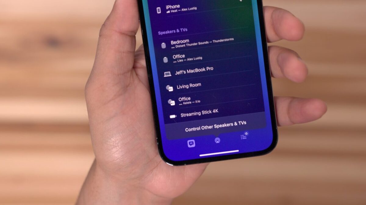 A Roku streaming stick glyph next to the AirPlay 2 logo on an iOS screen, illustrating the streaming-protocol layer the iOS 27 change would open.