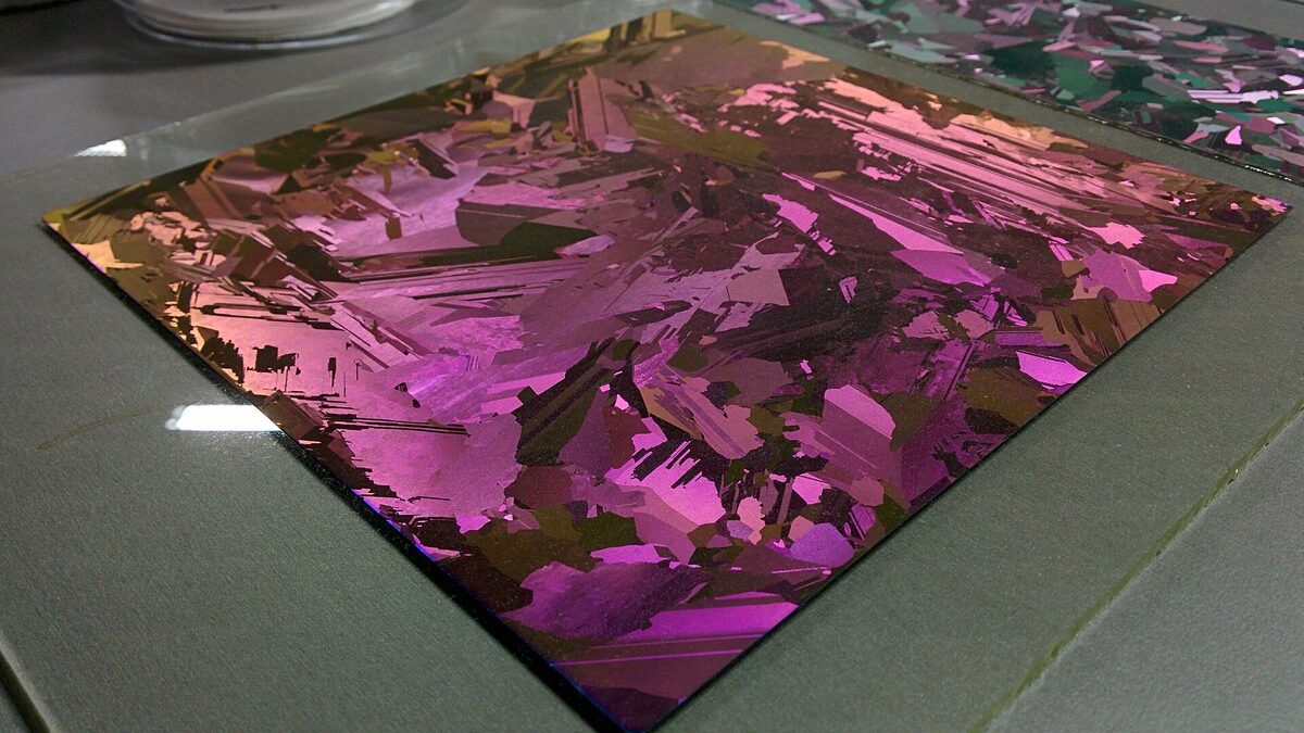 A multicrystalline silicon wafer showing thin-film iridescence, the raw material at the start of the chip supply chain.