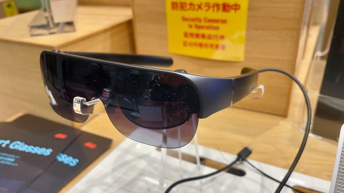 A person wearing a pair of consumer augmented reality smart glasses