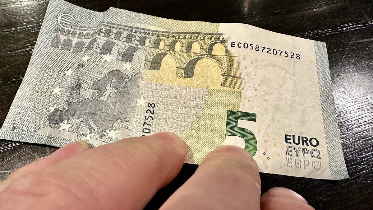 A stack of euro banknotes, illustrating European tech compensation data.