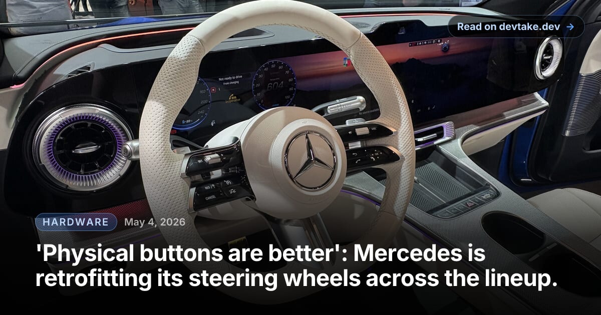 Interior of a Mercedes-Benz GLC showing the redesigned steering wheel with physical rocker switches and rollers next to the wide curved Hyperscreen dashboard display.